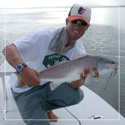 Captain John O'Hearn holds a healthy redfish